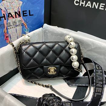 Chanel pearl chain flap bag 