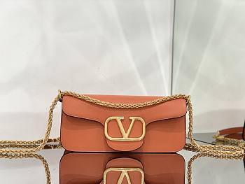 Valentino Garavani Locò orange leather crossbody bag