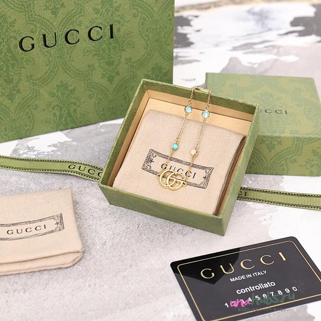 Gucci Gold and Blue Charm Bracelet - 1