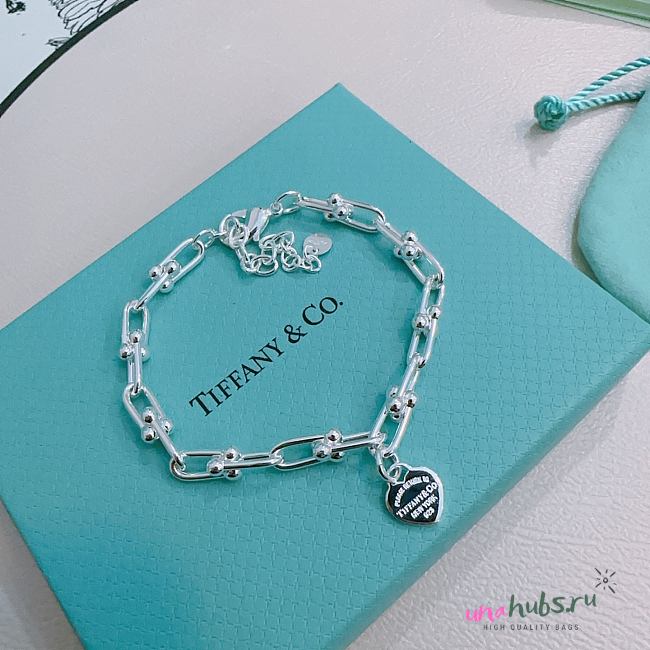 Tiffany & Co Return to Tiffany™ heart tag charm in sterling silver on a bracelet - 1