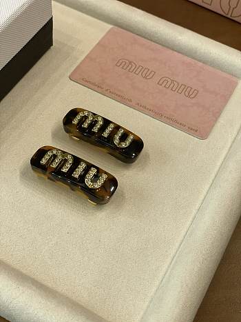 	 Miu Miu Plexiglas crystal brown hair clip